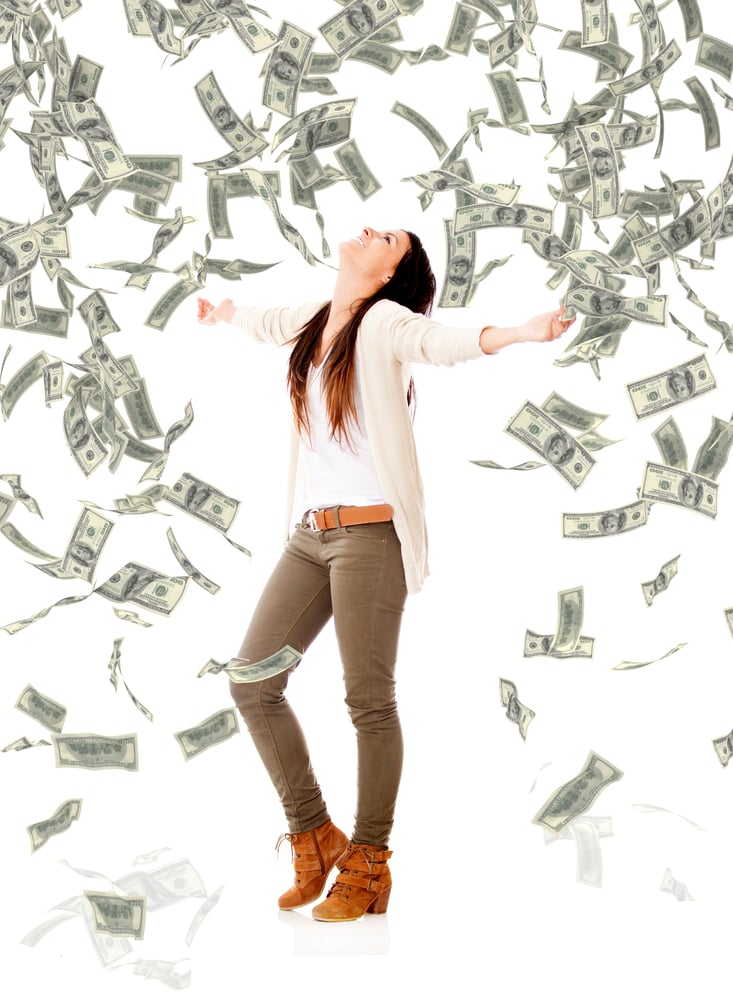 Excited woman under a money rain - isolated over a white background